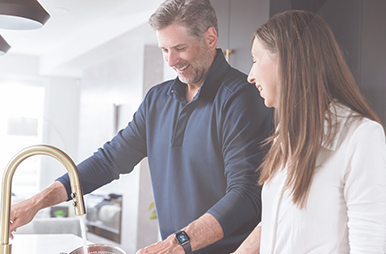 Couple at kitchen sink